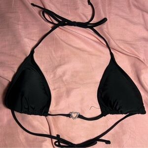 black bikini top with heart in between